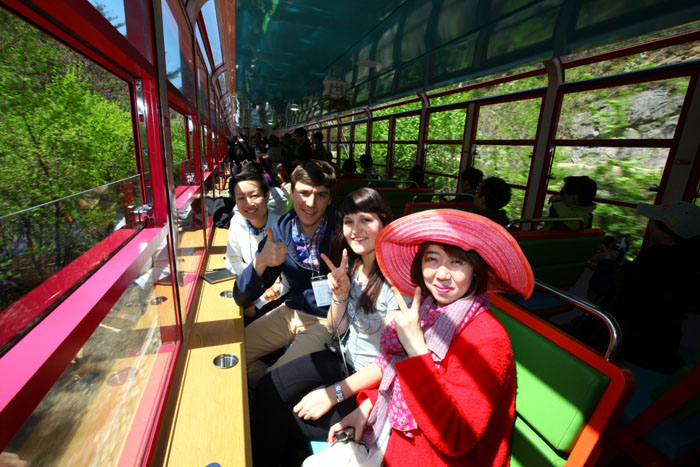 Participants of the FAM tour pose for a picture in the V-train (photo courtesy of KTO).