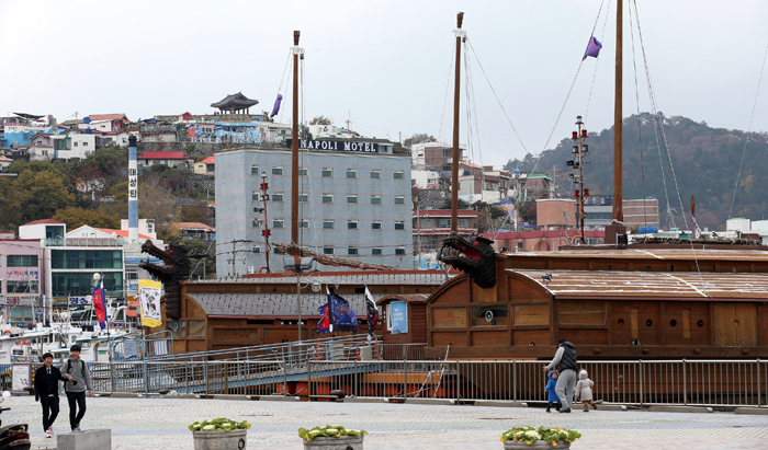 Turtle ships, a type of ancient battleships used by Admiral Yi Sun-sin in a series of naval battles, float on the sea just off shore in Tongyeong.